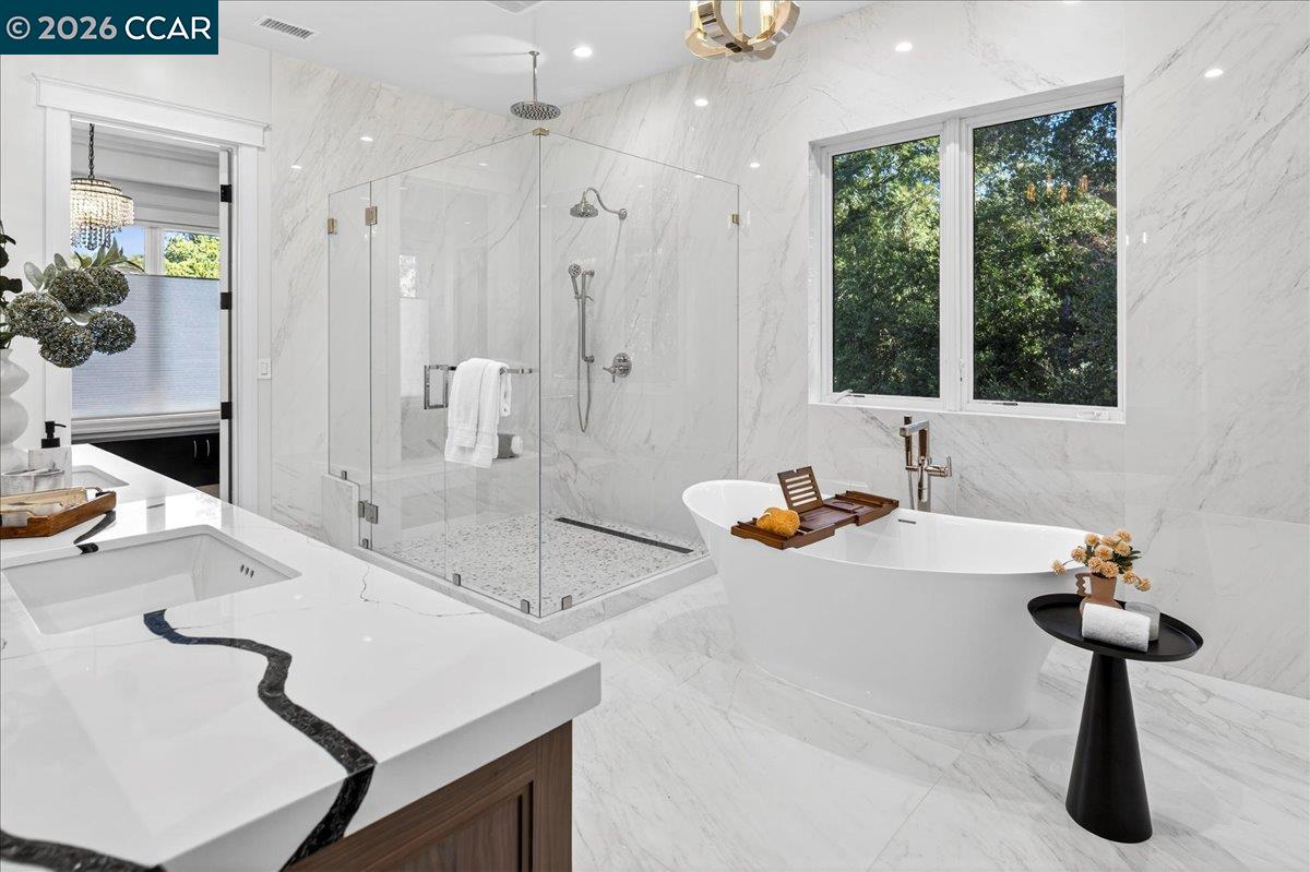 74 Middlefield Road Atherton, CA 94027 - Photo 32 of 49 a bathroom with a tub sink and mirror