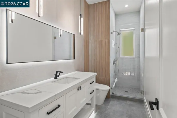 a bathroom with a sink and mirror