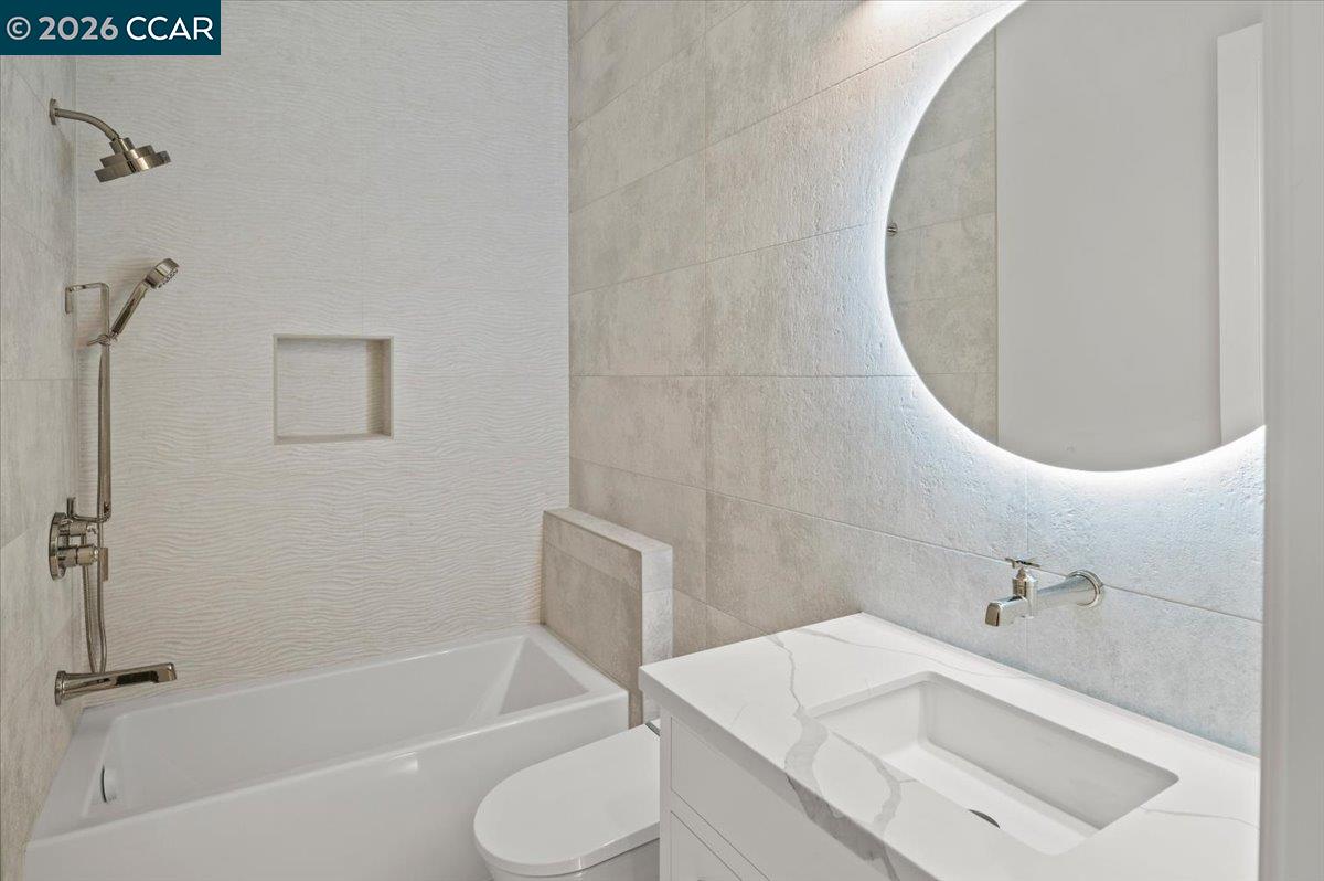 74 Middlefield Road Atherton, CA 94027 - Photo 35 of 49 a bathroom with a sink and a mirror