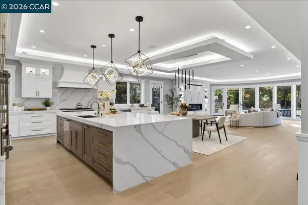 a large kitchen with stainless steel appliances lots of counter space