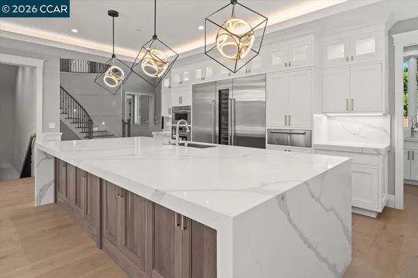 a large kitchen with a table and chairs
