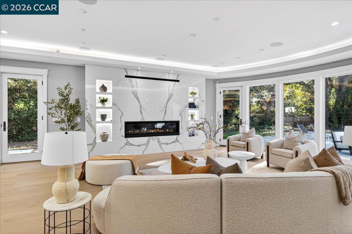74 Middlefield Road Atherton, CA 94027 - Photo 7 of 29 a living room with furniture a large window and a flat screen tv
