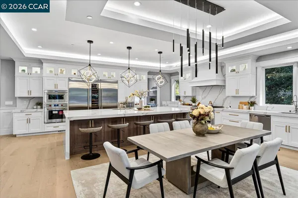 a kitchen with a table and chairs in it