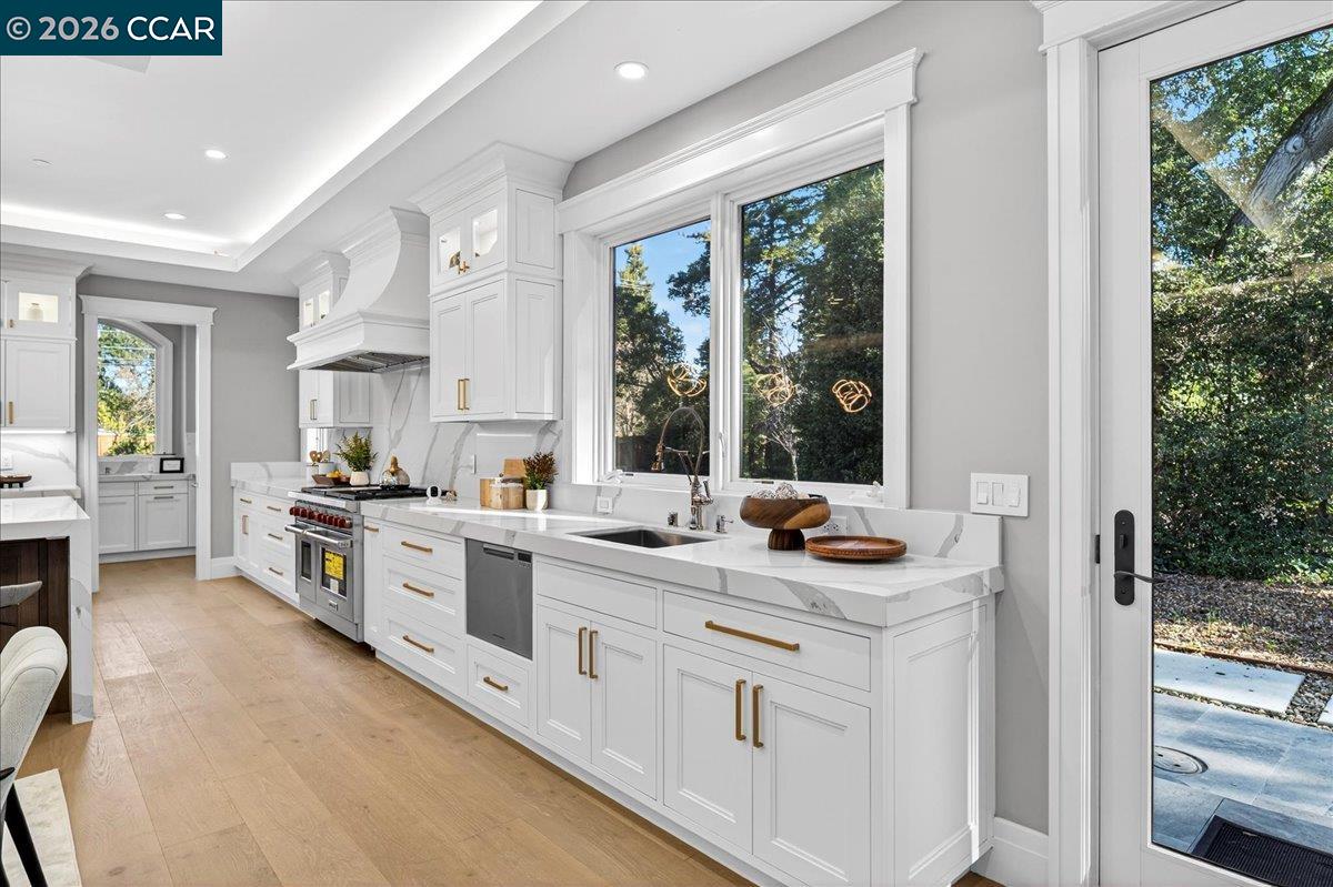 74 Middlefield Road Atherton, CA 94027 - Photo 10 of 49 a kitchen with stainless steel appliances granite countertop a stove and a sink