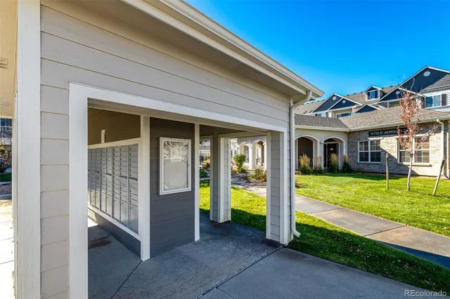 a living room with furniture a flat screen tv and outdoor seating