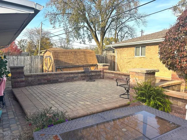 a view of a backyard with sitting area