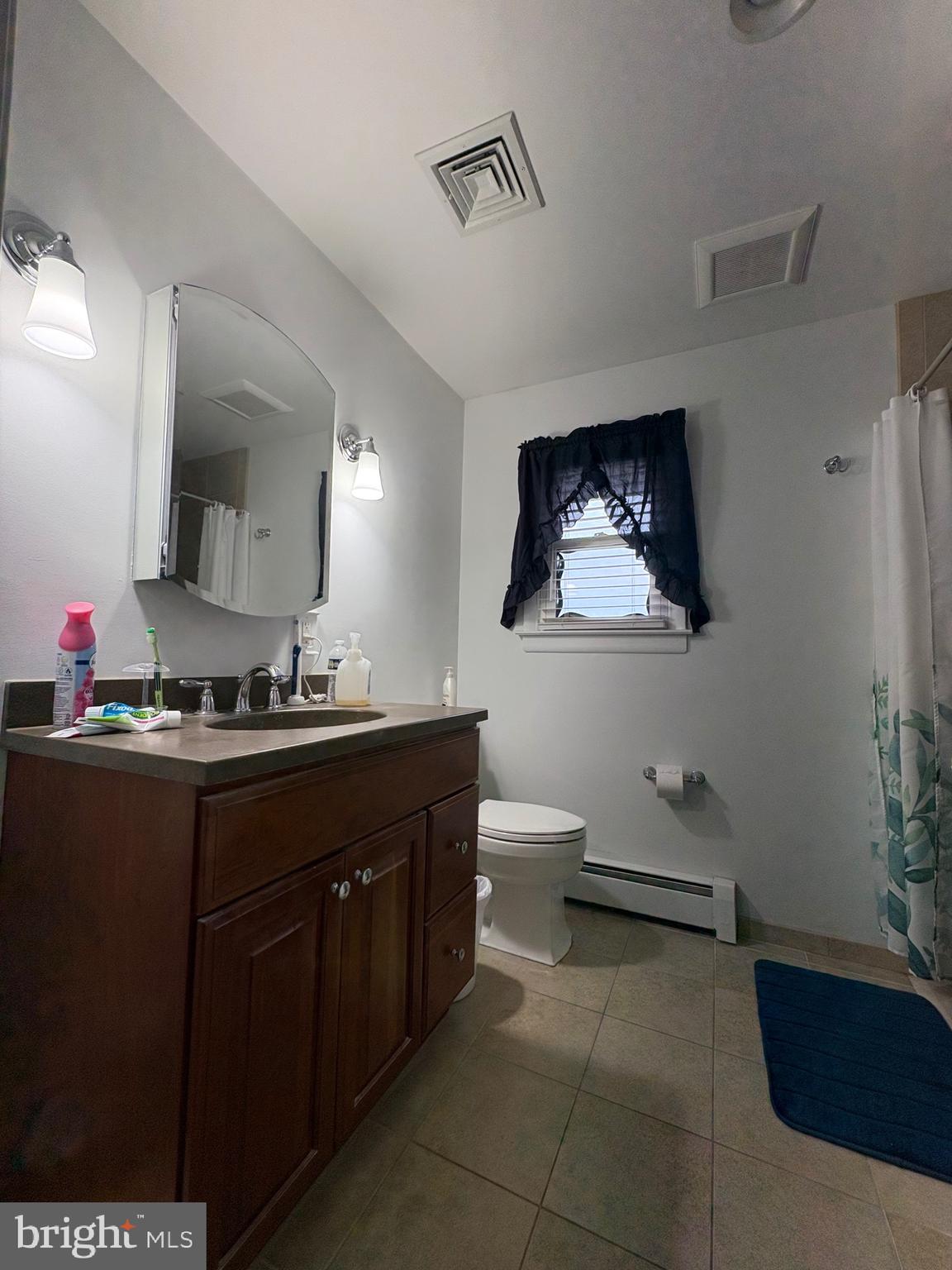 148 Amwellbury Road Salem, NJ 08079 - Photo 21 of 24 a bathroom with a sink and a mirror
