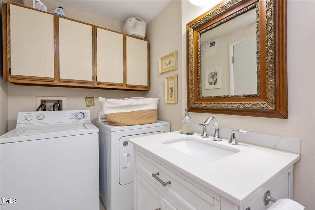 205 Spring Street Durham, NC 27703 - Photo 15 of 25 Downstairs bathroom + washer/dryer