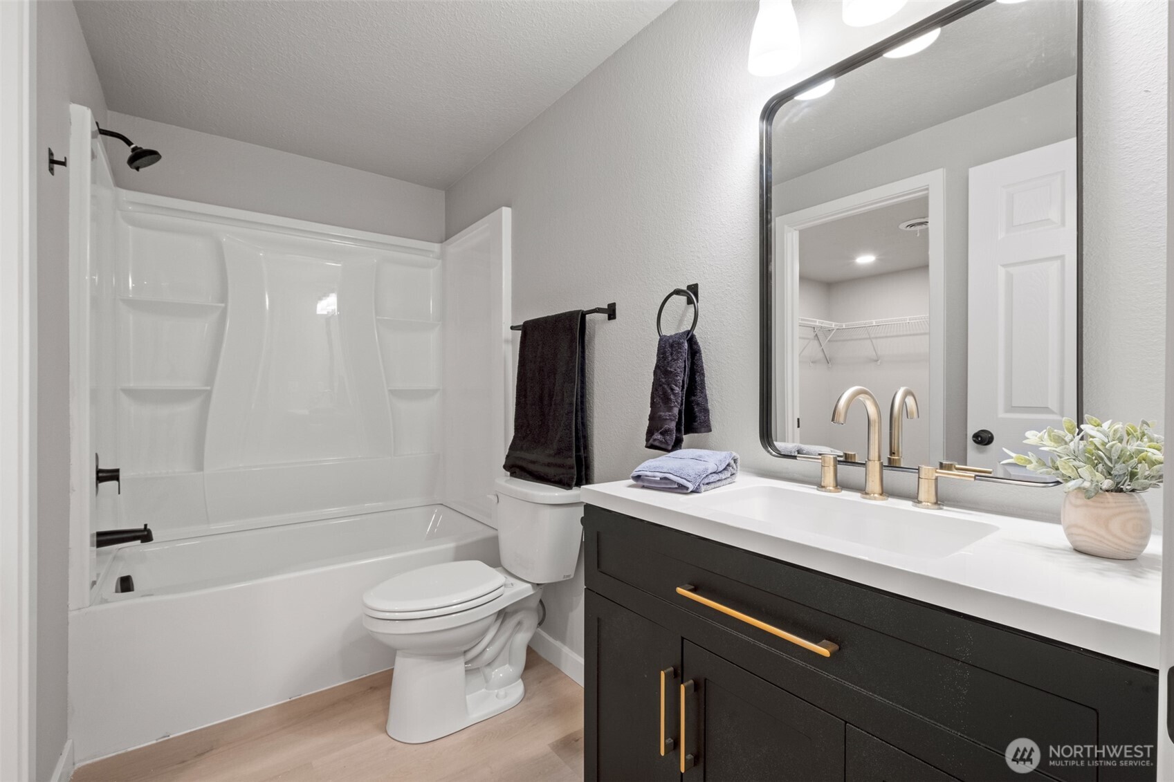 307 3rd Avenue Northeast Quincy, WA 98848 - Photo 13 of 26 a bathroom with a sink a toilet and shower