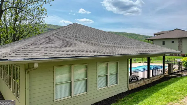 a backyard of a house with a garden and deck