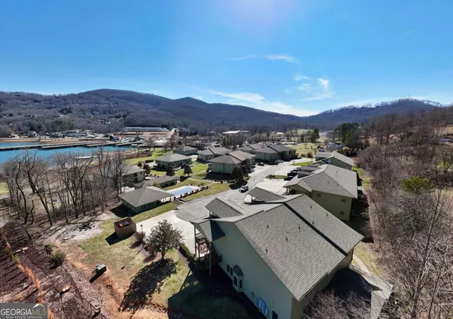 a view of a house with a mountain in the background
