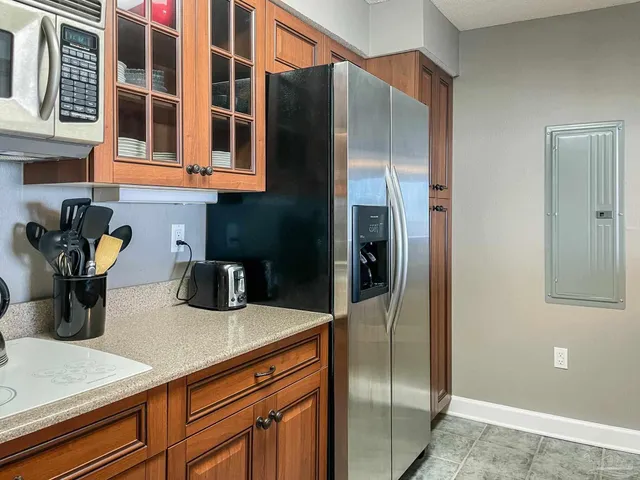 a kitchen with appliances and cabinets