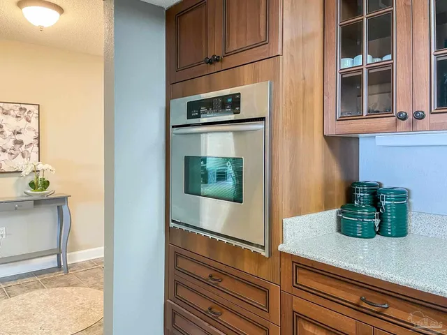 a kitchen with stainless steel appliances granite countertop a sink and cabinets