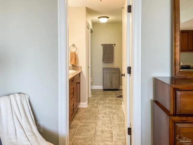 a bathroom with a sink a vanity and a mirror