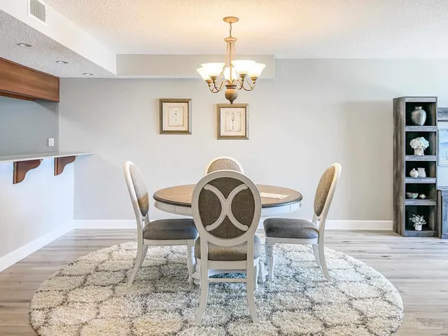 a kitchen with stainless steel appliances granite countertop a sink and stove top oven