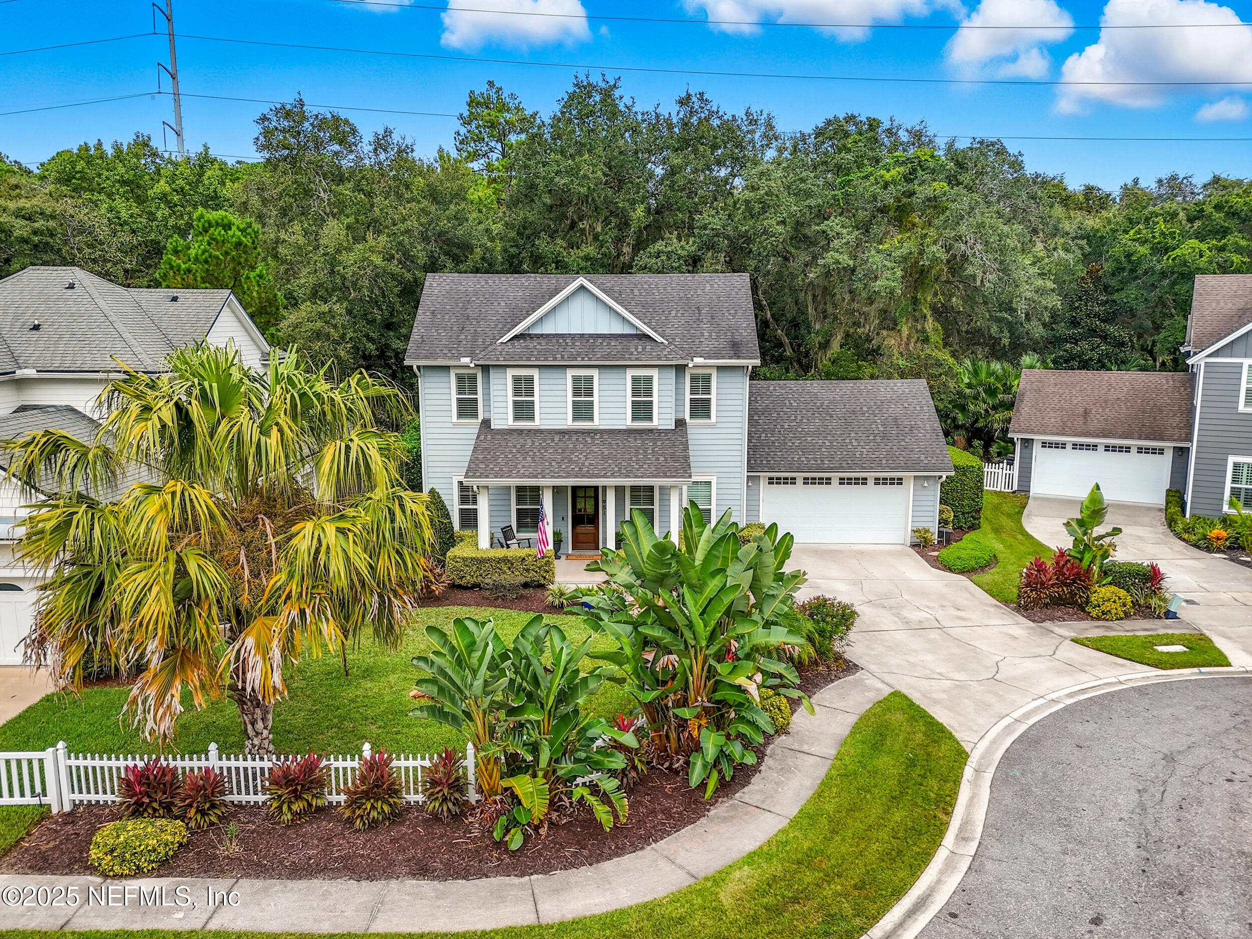 an aerial view of a house with a yard basket ball court and outdoor seating