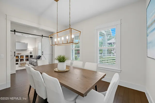 a kitchen with granite countertop white cabinets and white stainless steel appliances with a sink