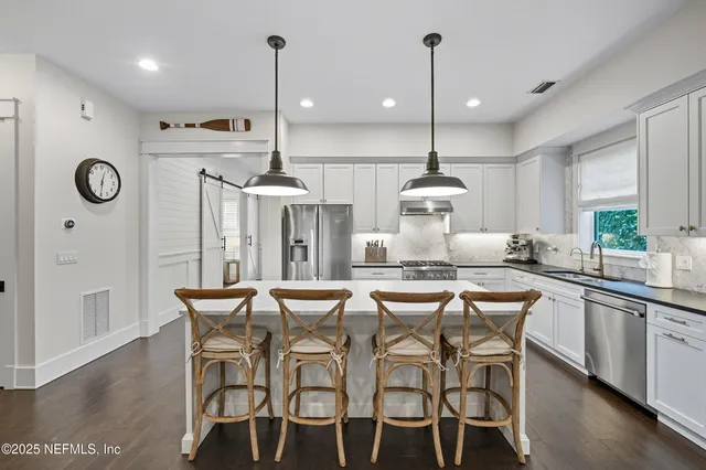 a bed room with a bed and a large window