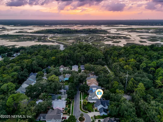 a front view of a house with a yard table and chairs