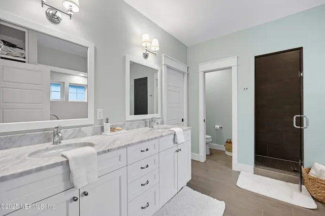 a wooden table and chair under an umbrella
