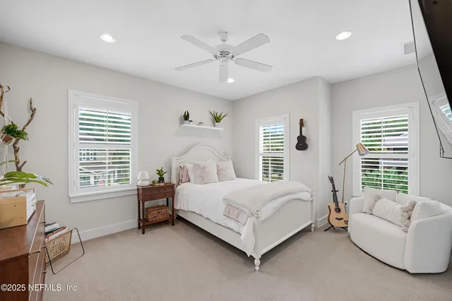 a view of a patio with table and chairs under an umbrella