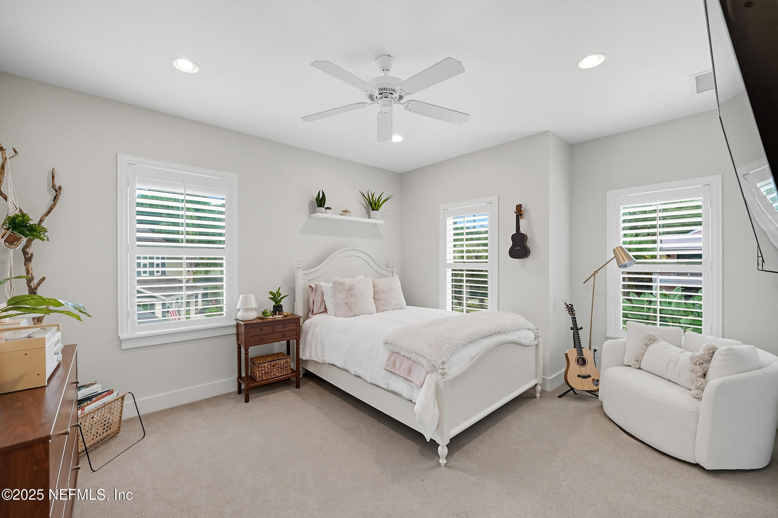 951 Paradise Circle Atlantic Beach, FL 32233 - Photo 28 of 76 a bed room with a bed and a couch