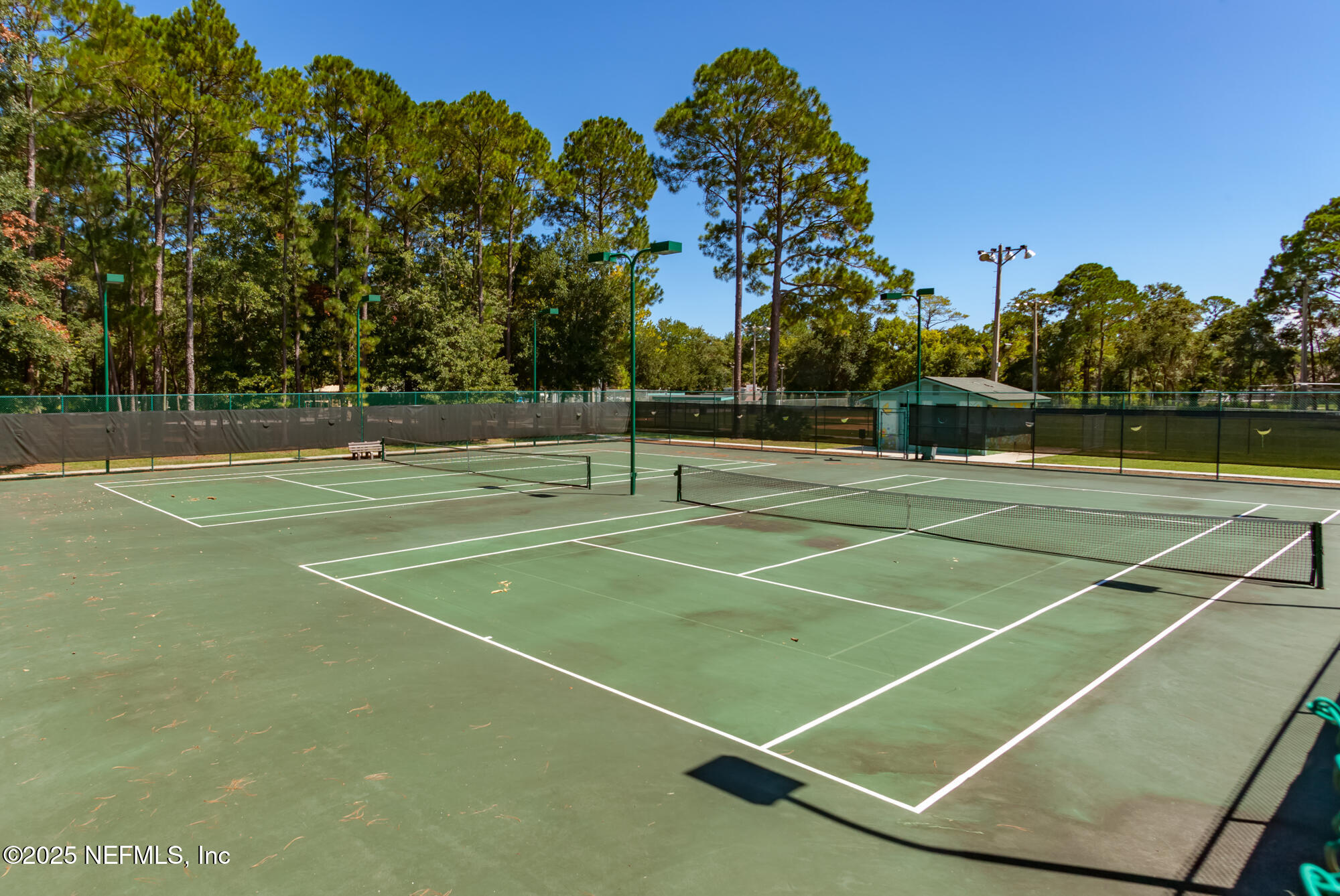 951 Paradise Circle Atlantic Beach, FL 32233 - Photo 67 of 76 a tennis court that has tennis net
