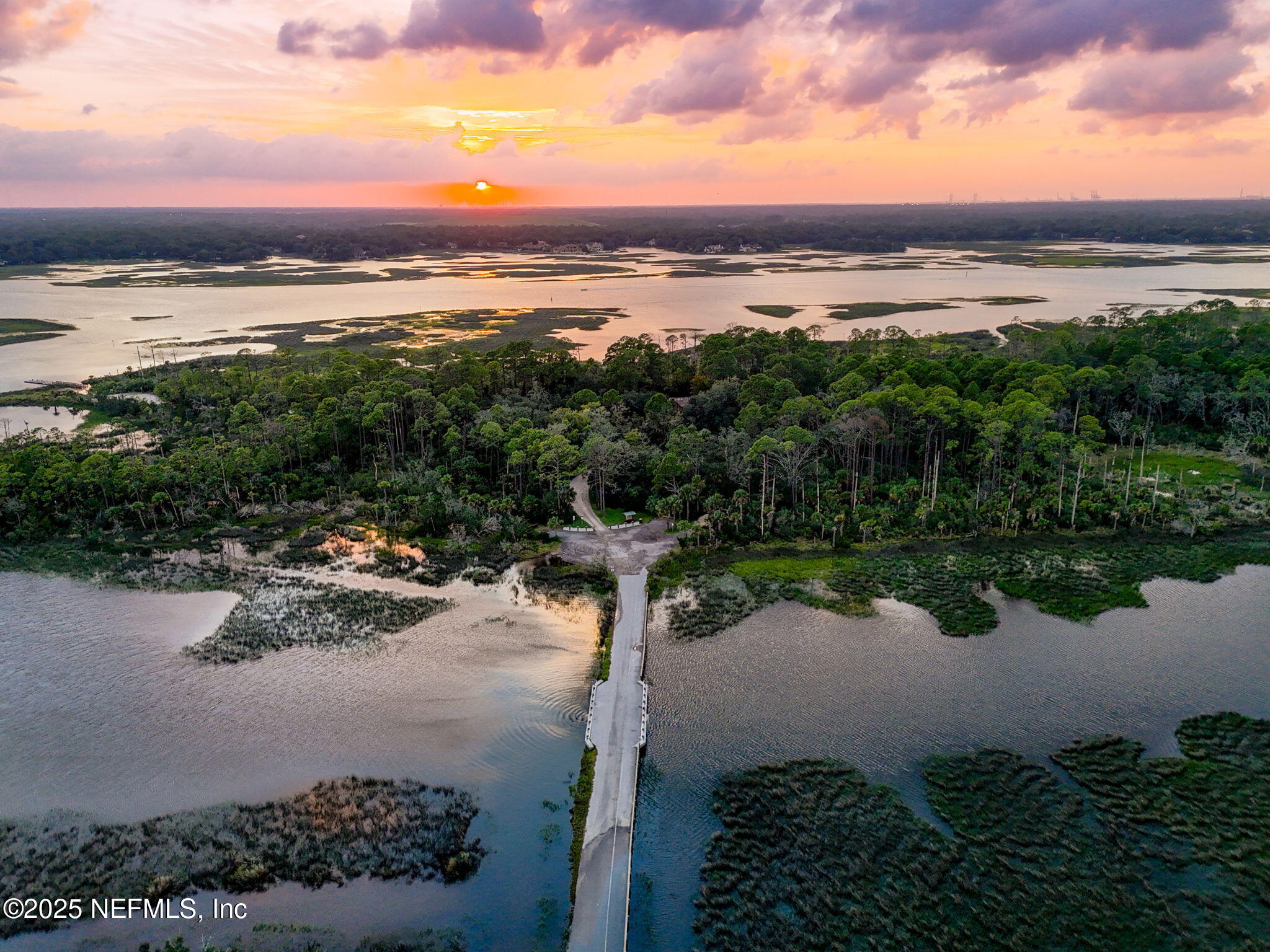 951 Paradise Circle Atlantic Beach, FL 32233 - Photo 76 of 76 a view of a lake with a mountain in the background
