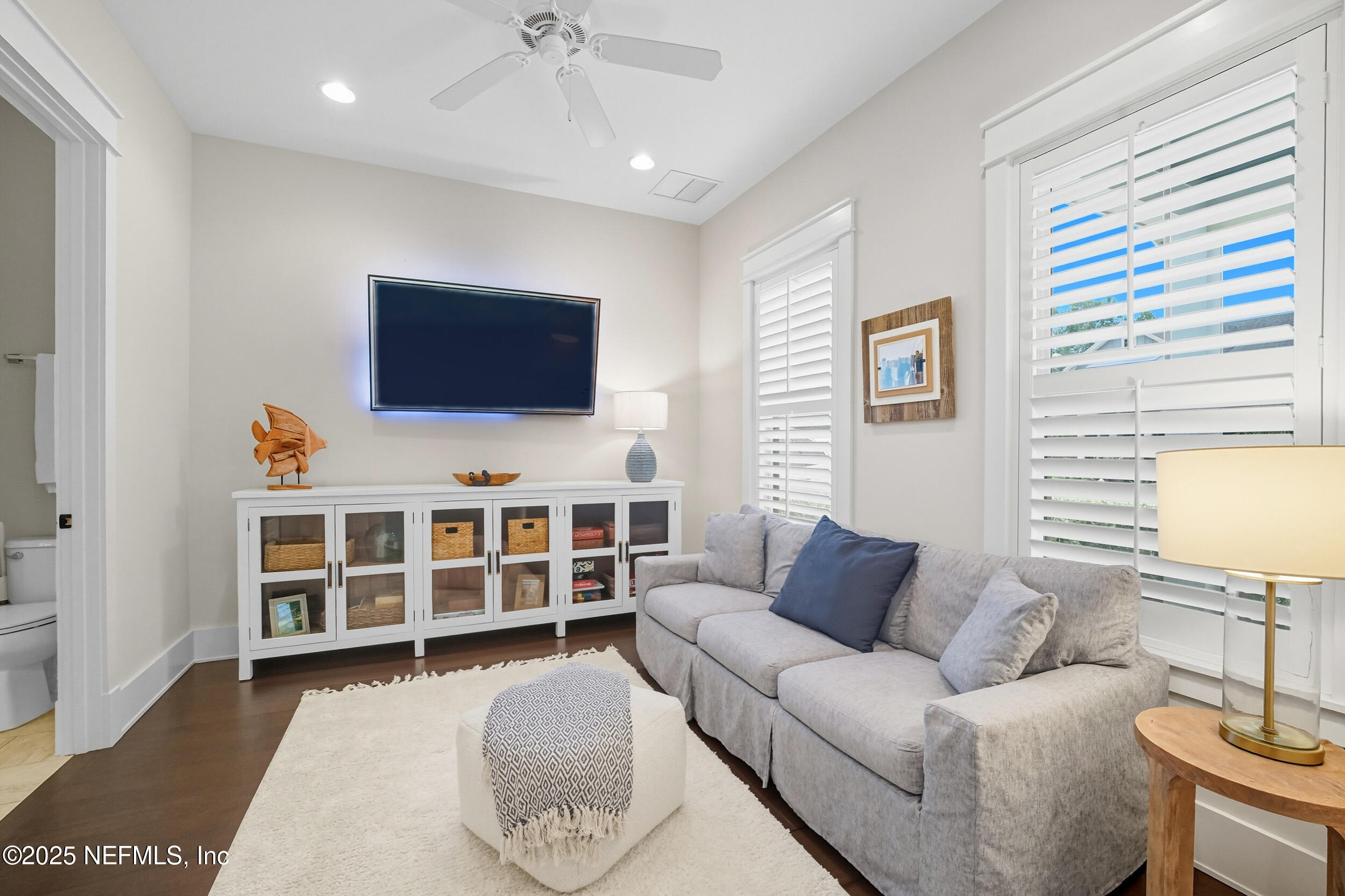 951 Paradise Circle Atlantic Beach, FL 32233 - Photo 9 of 76 a living room with furniture and a flat screen tv