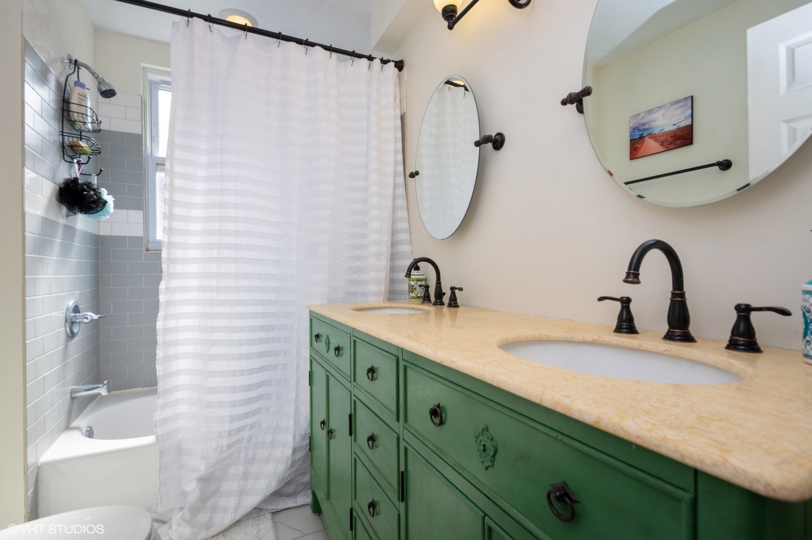 2710 West Fletcher Street Chicago, IL 60618 - Photo 13 of 24 a bathroom with a double vanity sink mirror and shower