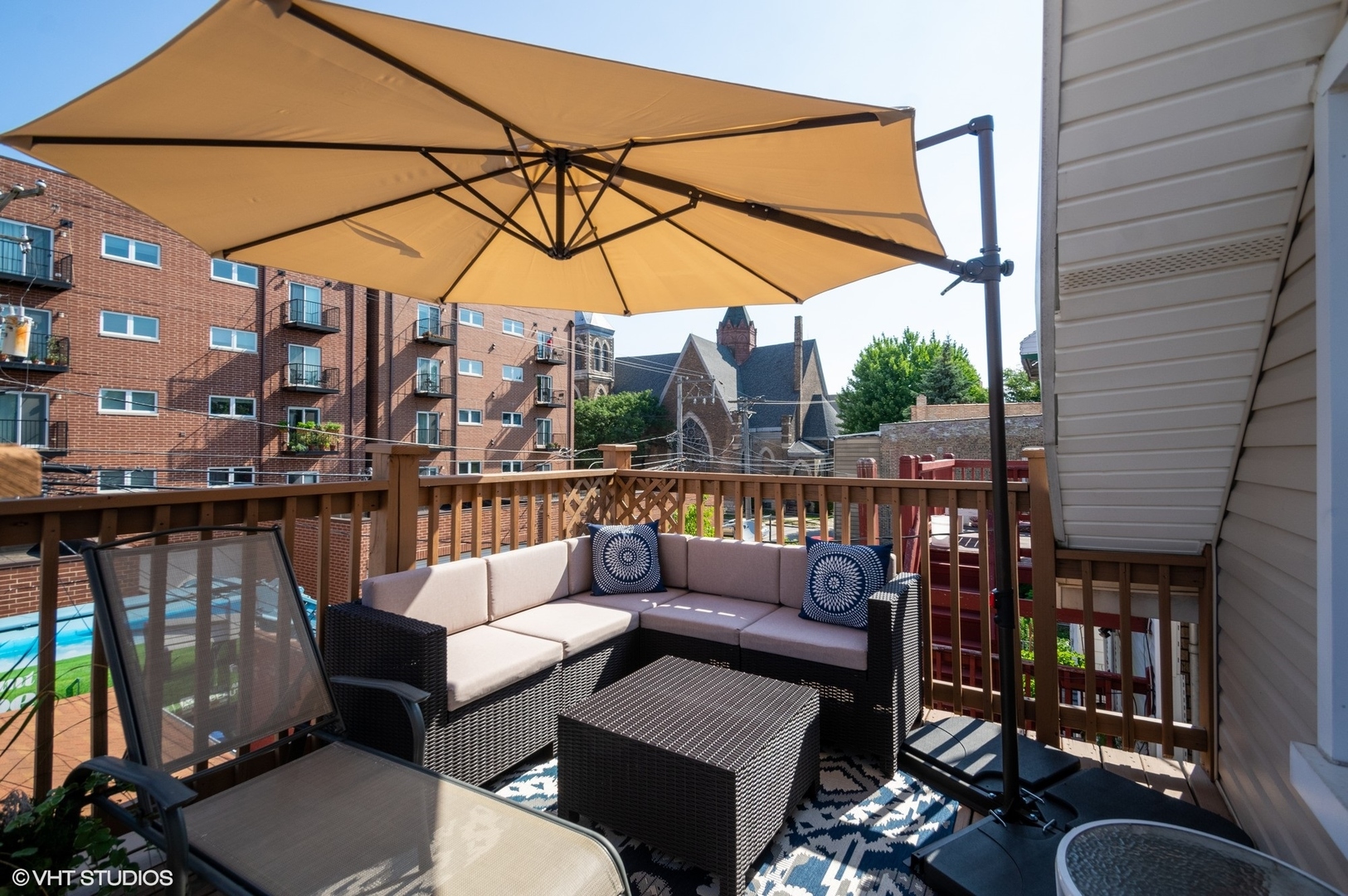 2710 West Fletcher Street Chicago, IL 60618 - Photo 15 of 24 a view of a rooftop deck with couch and chairs