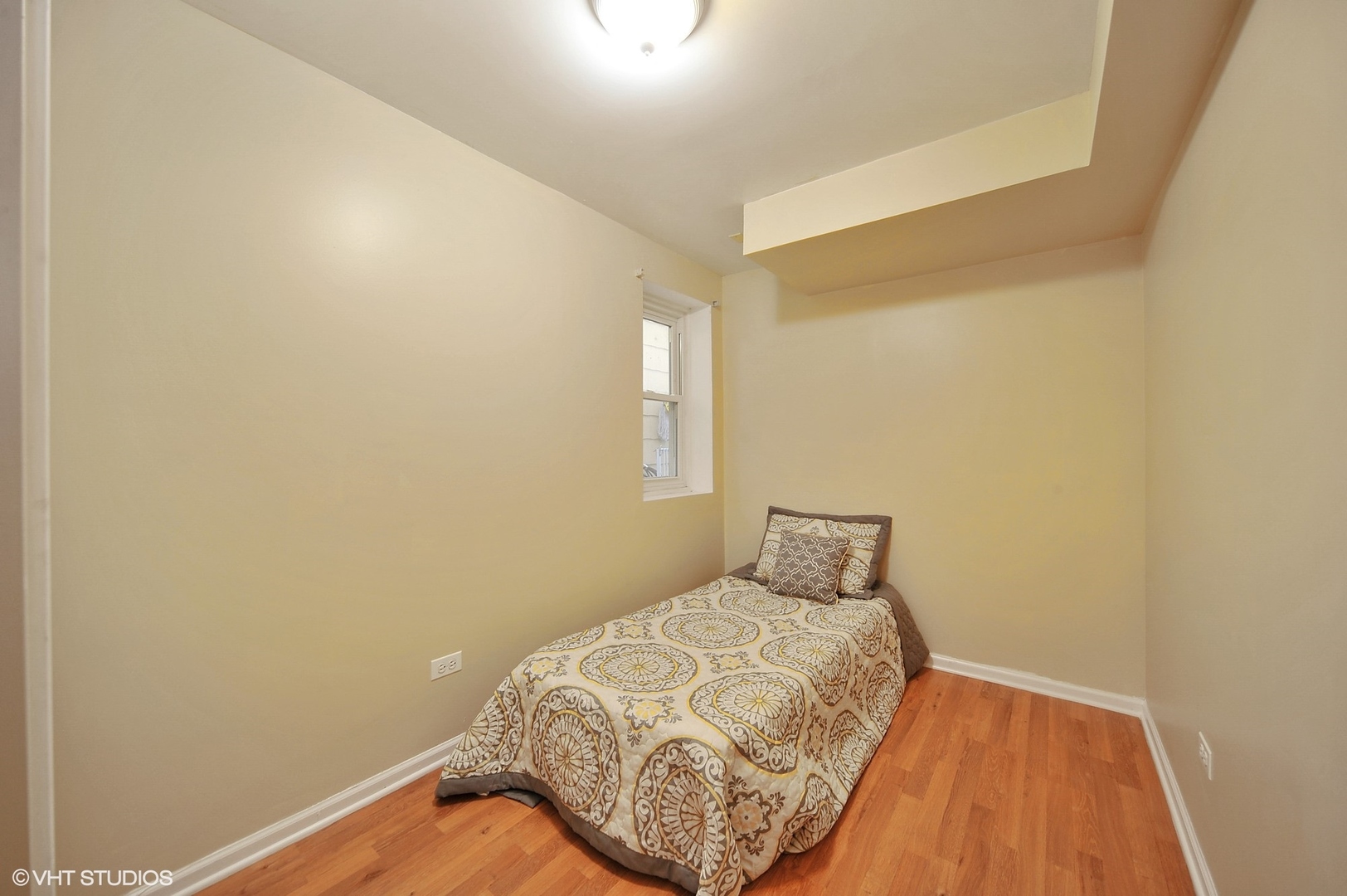 2710 West Fletcher Street Chicago, IL 60618 - Photo 22 of 24 a bedroom with a bed and wooden floor
