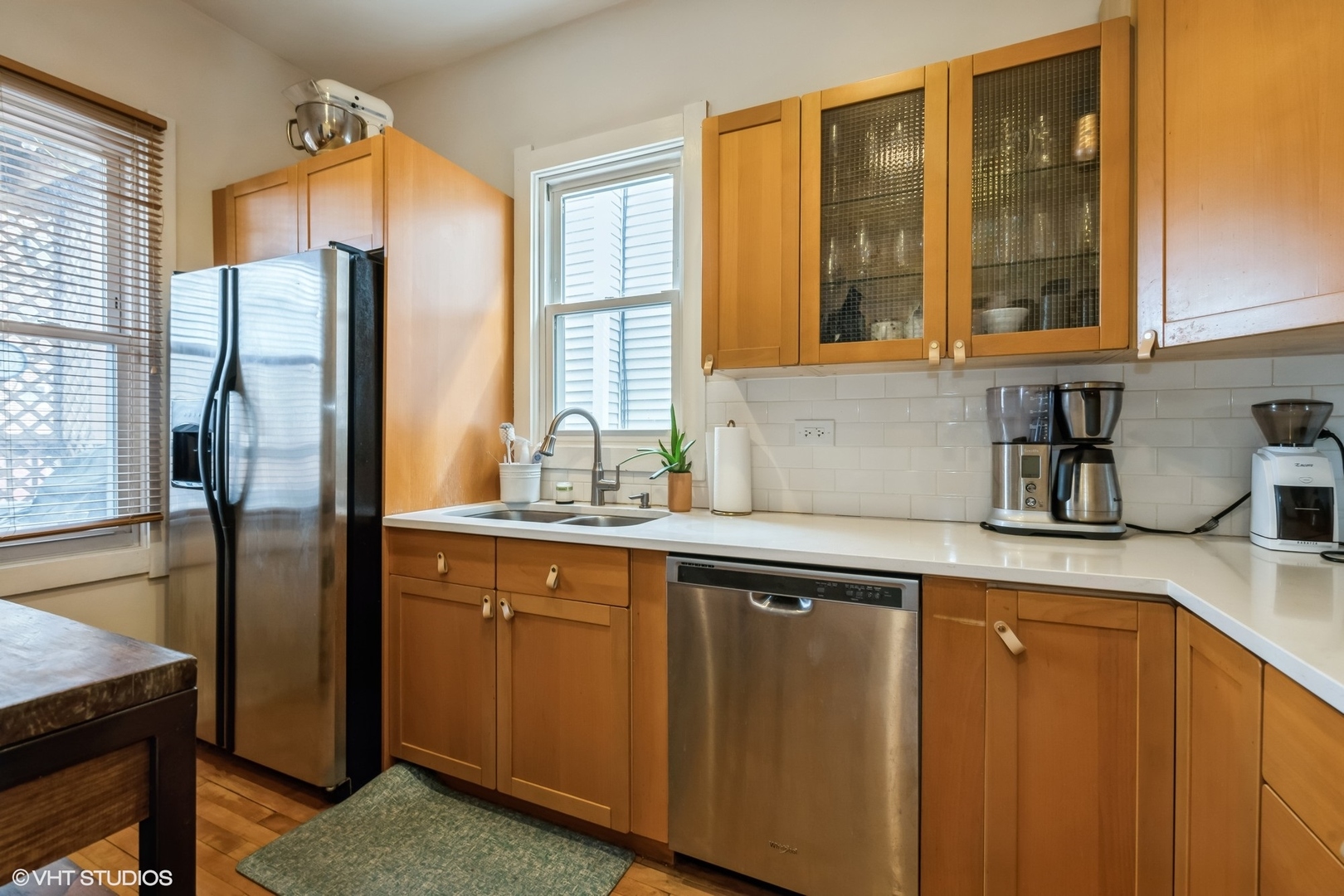 2710 West Fletcher Street Chicago, IL 60618 - Photo 3 of 24 a kitchen with stainless steel appliances granite countertop a refrigerator and a sink