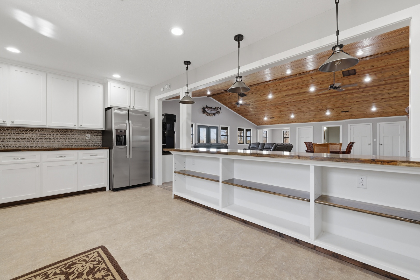 3675 Parrish Ridge Lane Goreville, IL 62939 - Photo 25 of 43 a kitchen with stainless steel appliances kitchen island granite countertop a refrigerator a stove and a sink with cabinets