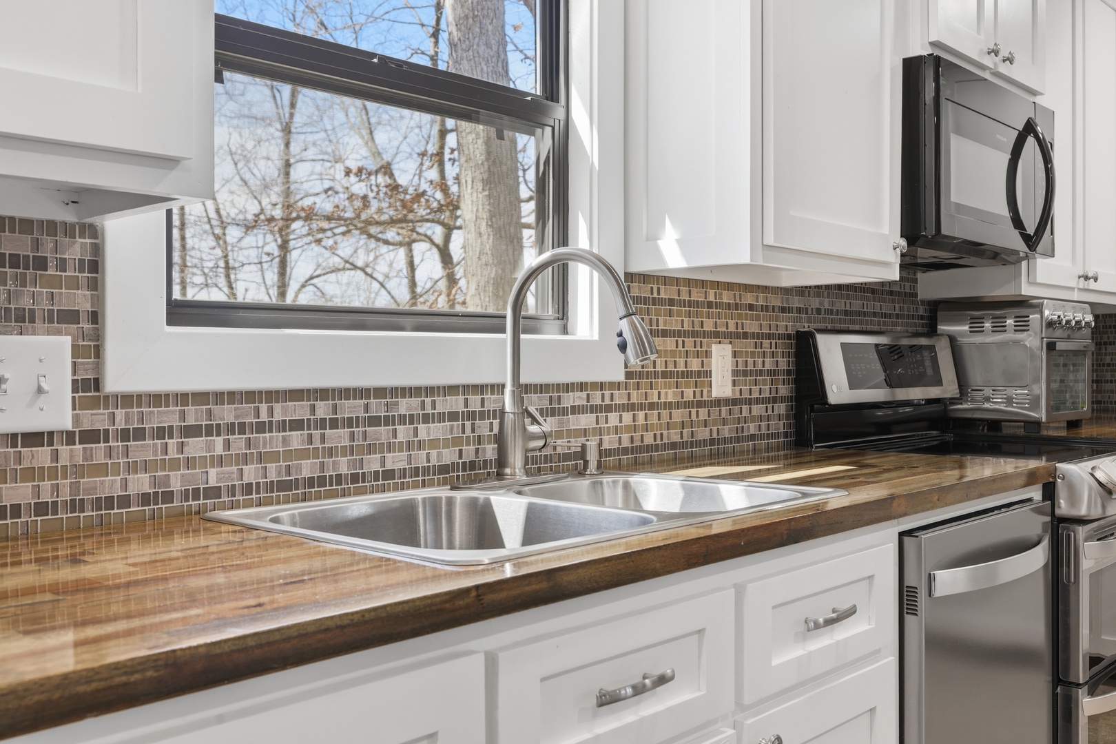 3675 Parrish Ridge Lane Goreville, IL 62939 - Photo 27 of 43 a kitchen with a sink and cabinets