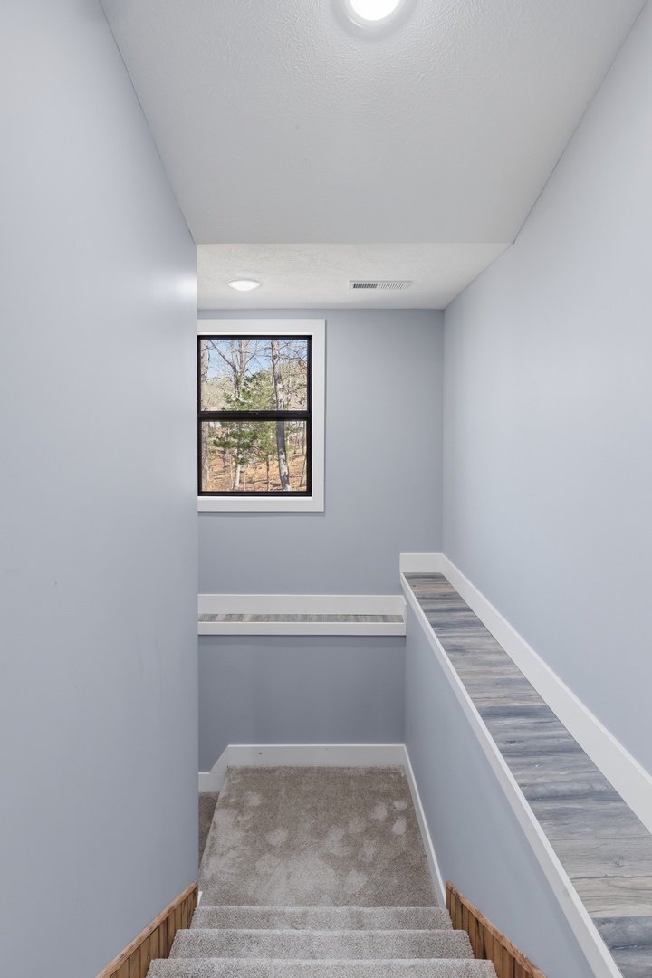 3675 Parrish Ridge Lane Goreville, IL 62939 - Photo 32 of 43 a view of a room with wooden floor and white walls