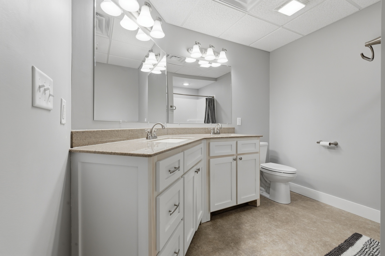 3675 Parrish Ridge Lane Goreville, IL 62939 - Photo 40 of 43 a spacious bathroom with a granite countertop sink a toilet and a mirror
