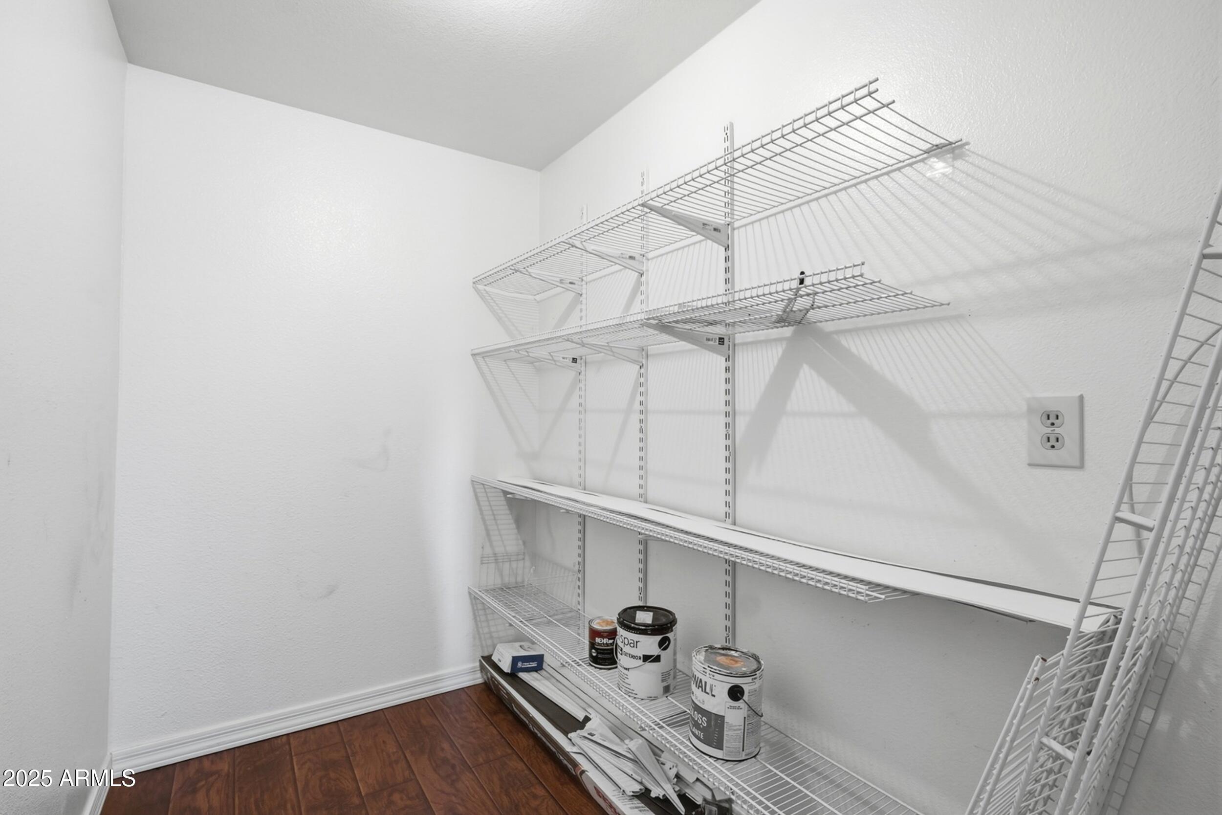 1831 East Kirkland Lane, Unit B Tempe, AZ 85288 - Photo 12 of 33 a view of storage and utility room with empty racks