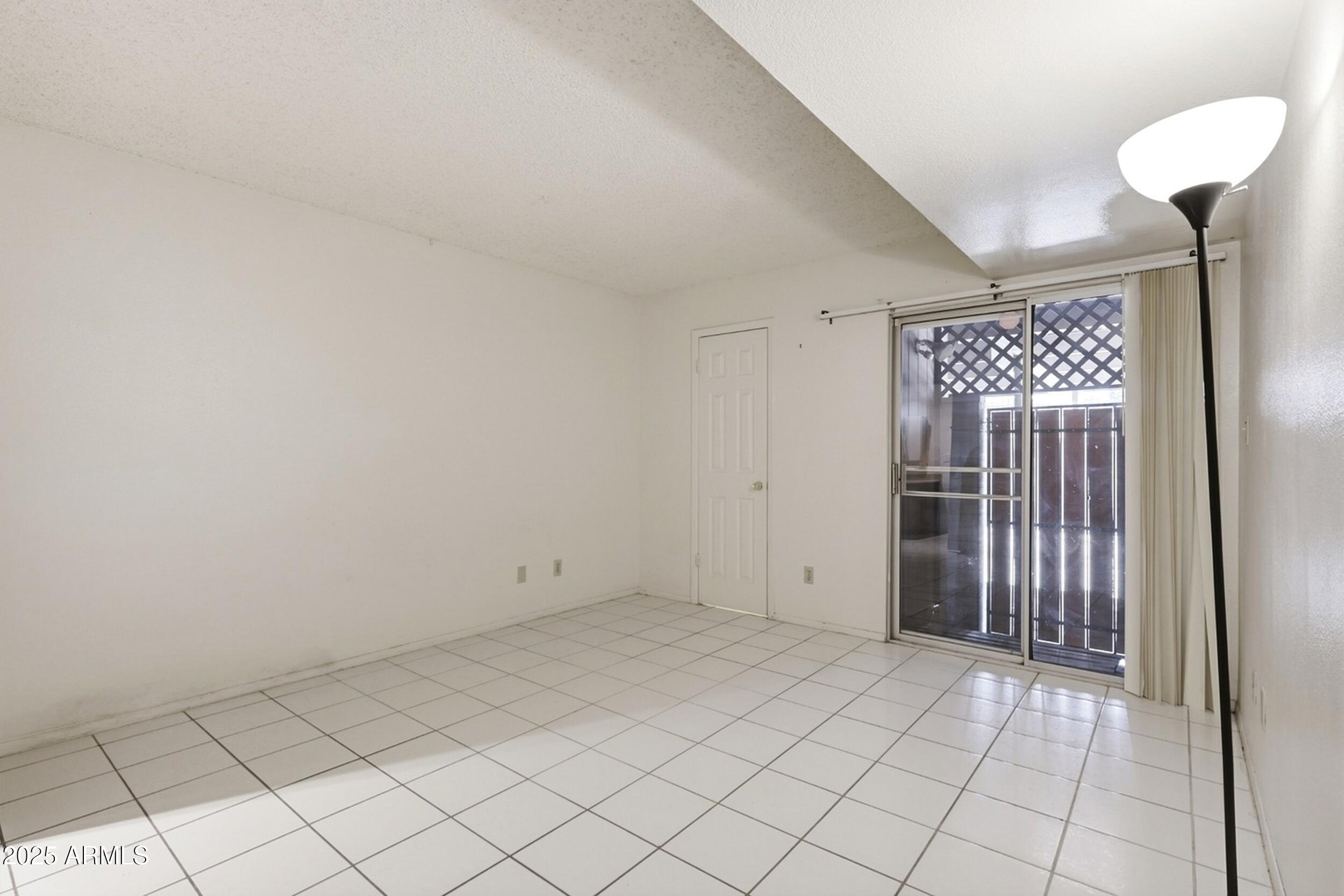 1831 East Kirkland Lane, Unit B Tempe, AZ 85288 - Photo 13 of 33 an empty room with a cabinet and a shower