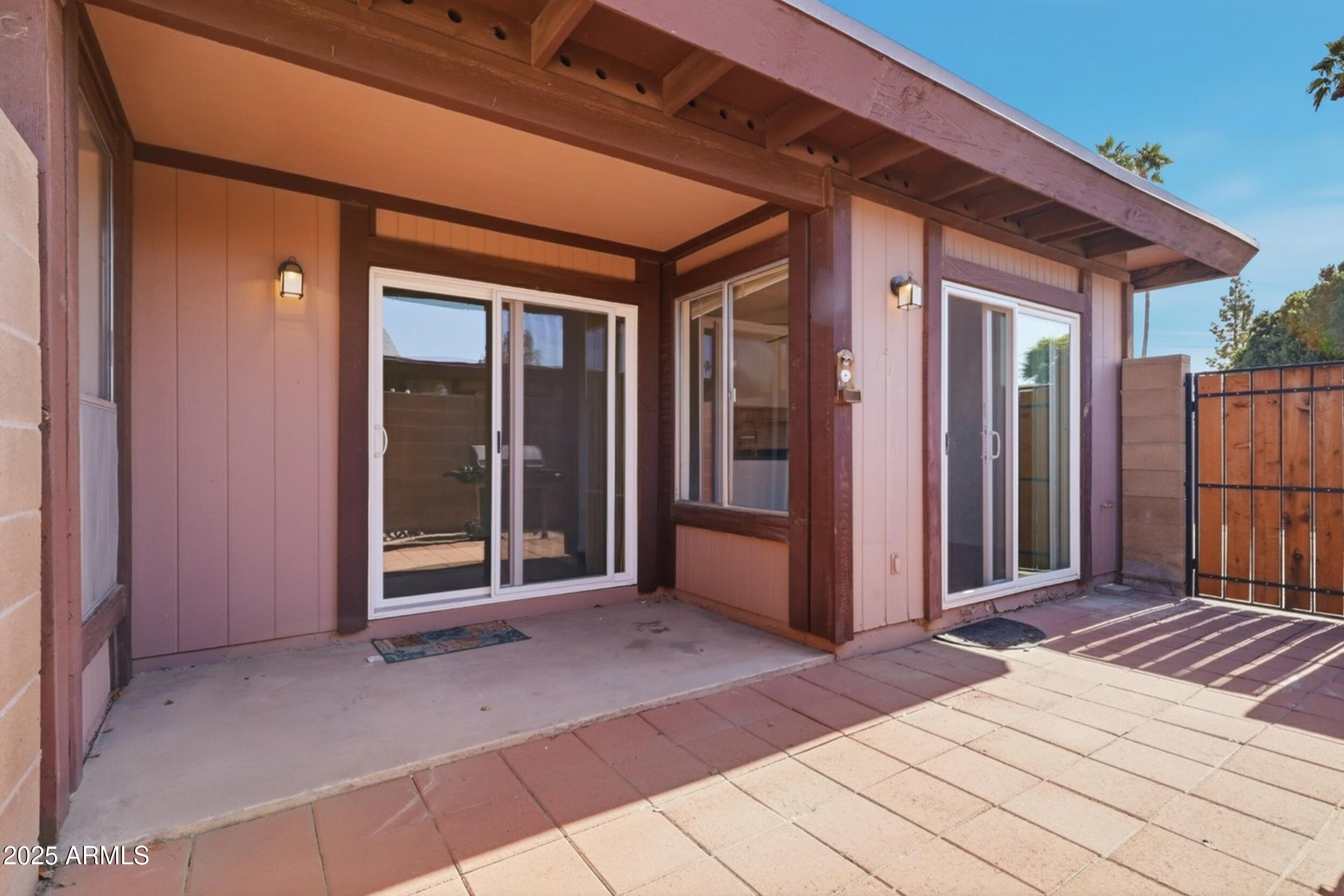 1831 East Kirkland Lane, Unit B Tempe, AZ 85288 - Photo 2 of 33 a view of a porch with wooden floor and stairs