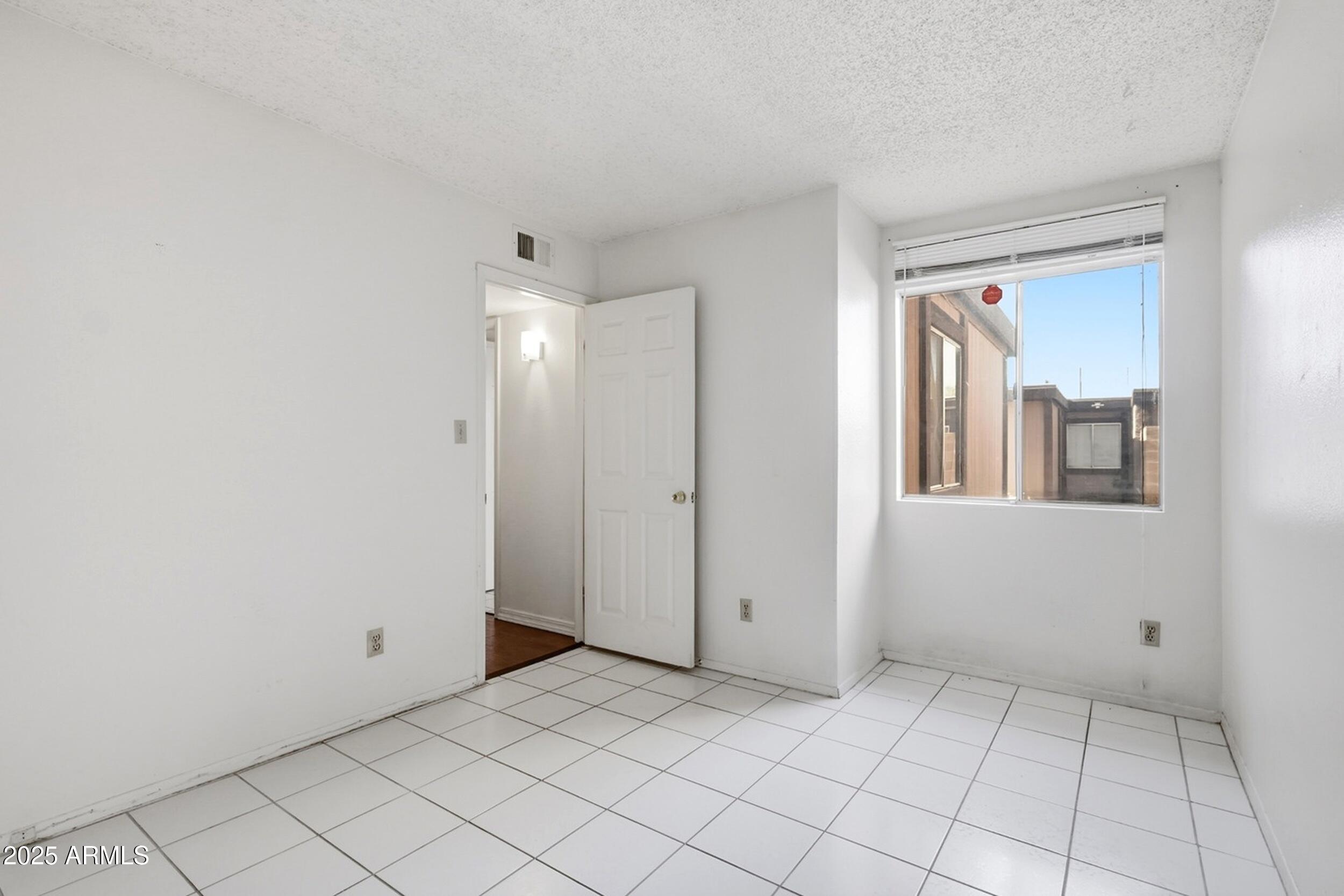 1831 East Kirkland Lane, Unit B Tempe, AZ 85288 - Photo 23 of 33 a view of an empty room