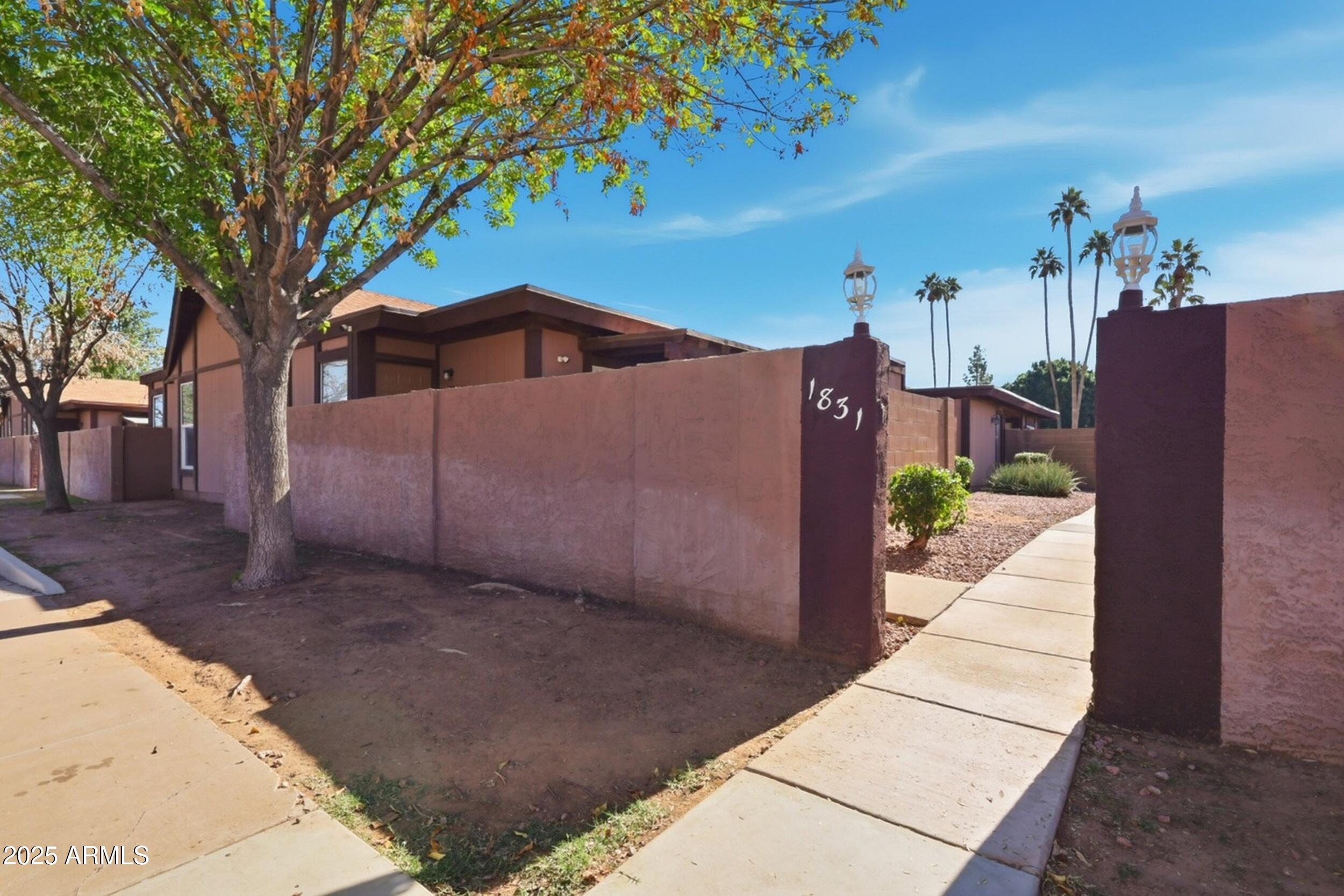 1831 East Kirkland Lane, Unit B Tempe, AZ 85288 - Photo 29 of 33 a front view of a house with a yard