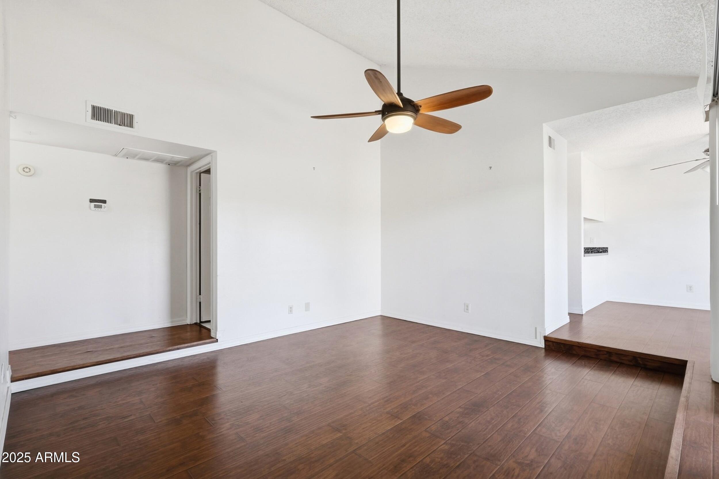 1831 East Kirkland Lane, Unit B Tempe, AZ 85288 - Photo 6 of 33 a view of empty room with wooden floor