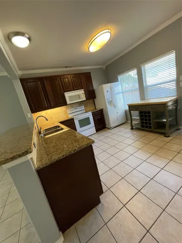 a bedroom with bed and a window