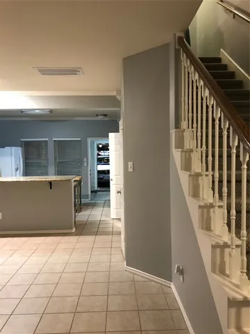 a view of entryway and kitchen