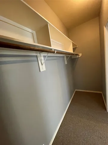 a view of a room with racks on the wall