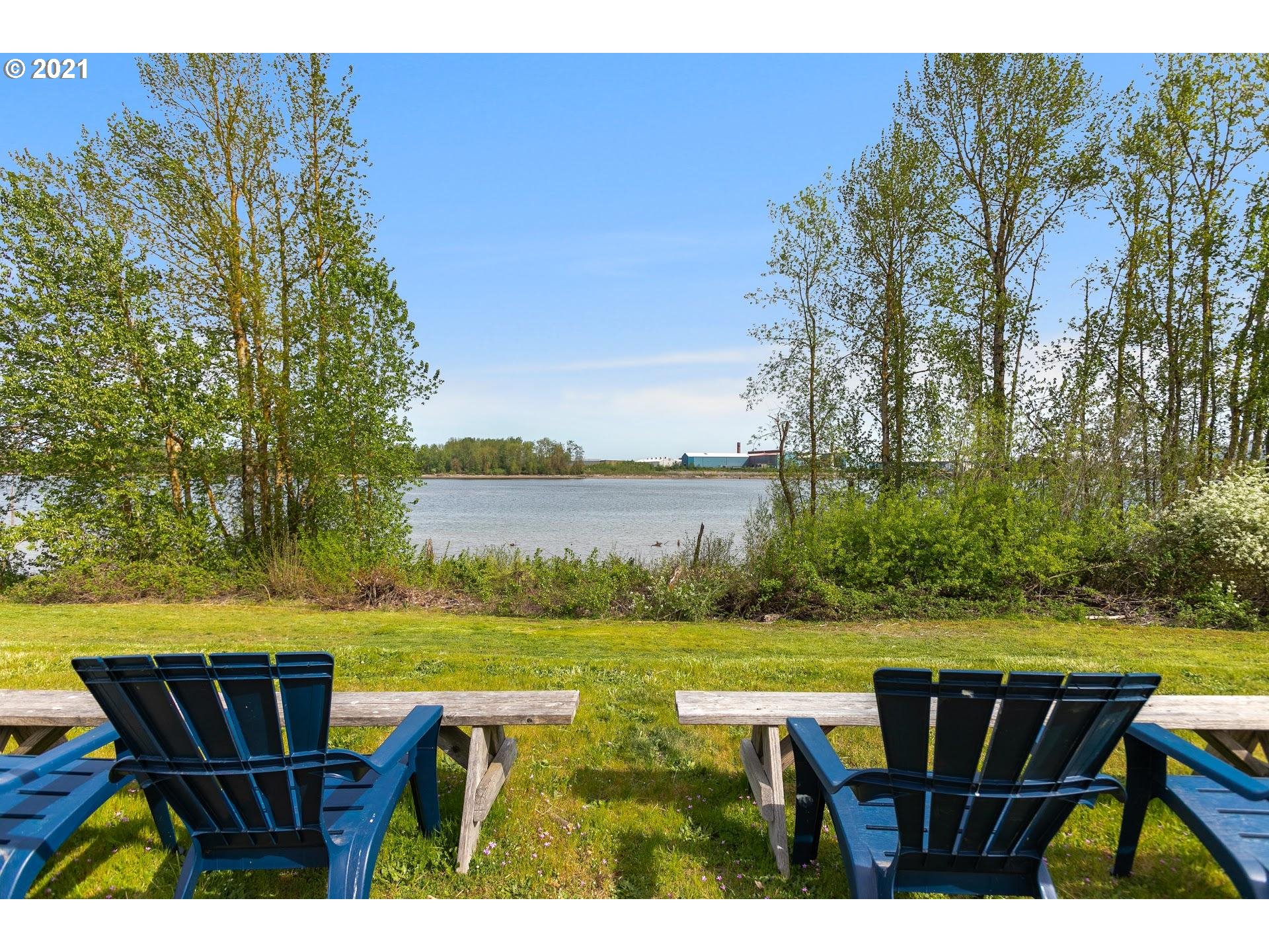 15620 Northwest Gillihan Road Portland, OR 97231 - Photo 2 of 29 a view of a lake with table and chairs