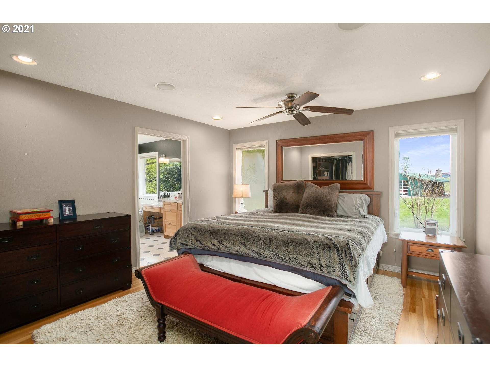 15620 Northwest Gillihan Road Portland, OR 97231 - Photo 11 of 29 a bedroom with a bed and a dresser