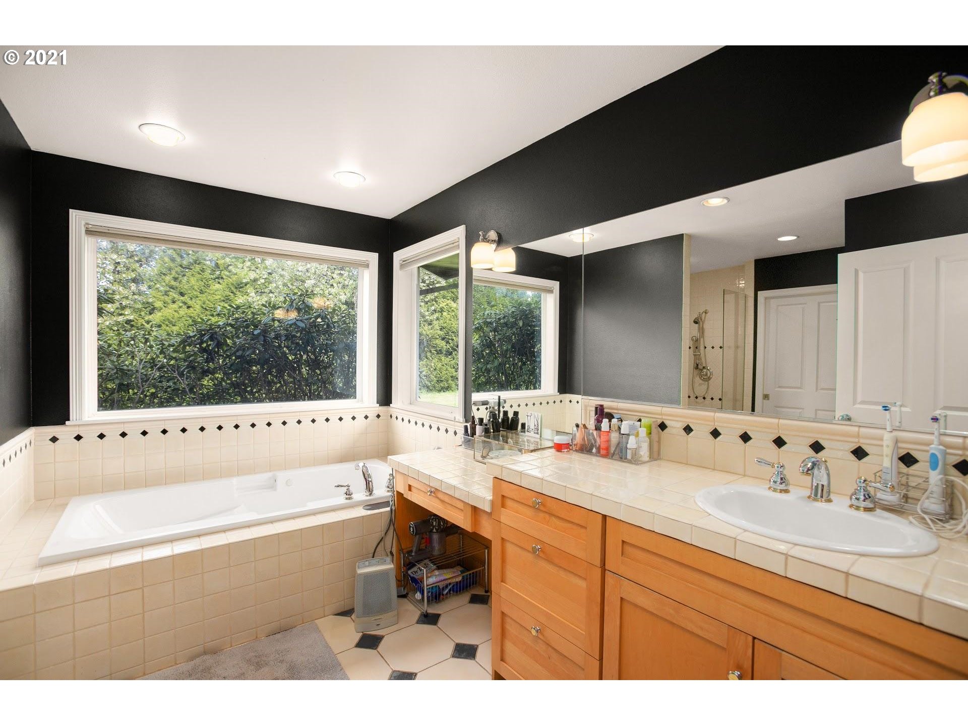 15620 Northwest Gillihan Road Portland, OR 97231 - Photo 12 of 29 a bathroom with a large tub sink and window