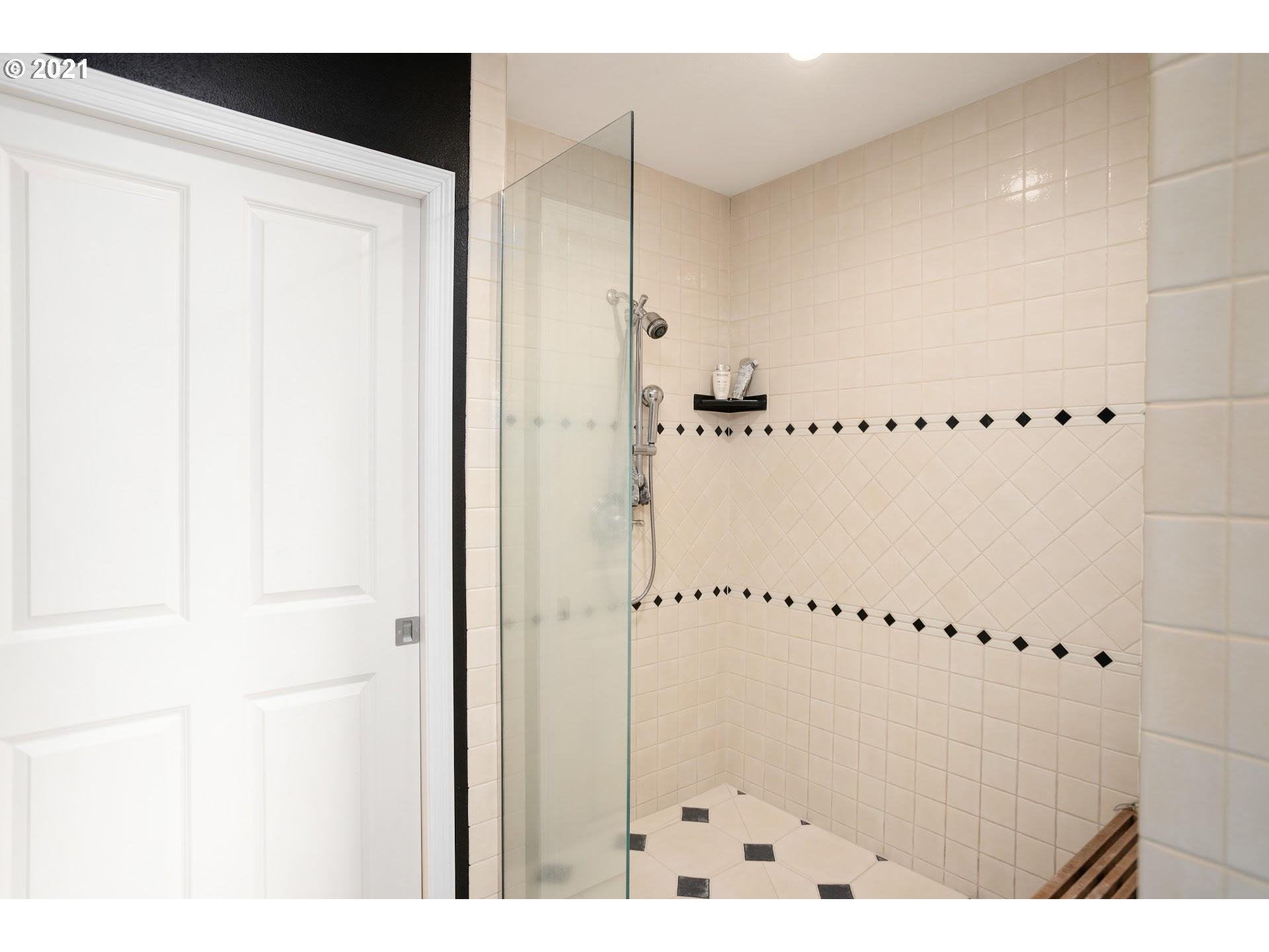 15620 Northwest Gillihan Road Portland, OR 97231 - Photo 14 of 29 a bathroom with a shower